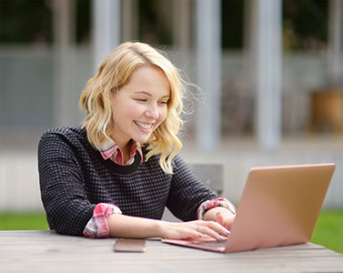 Woman typing on a laptop